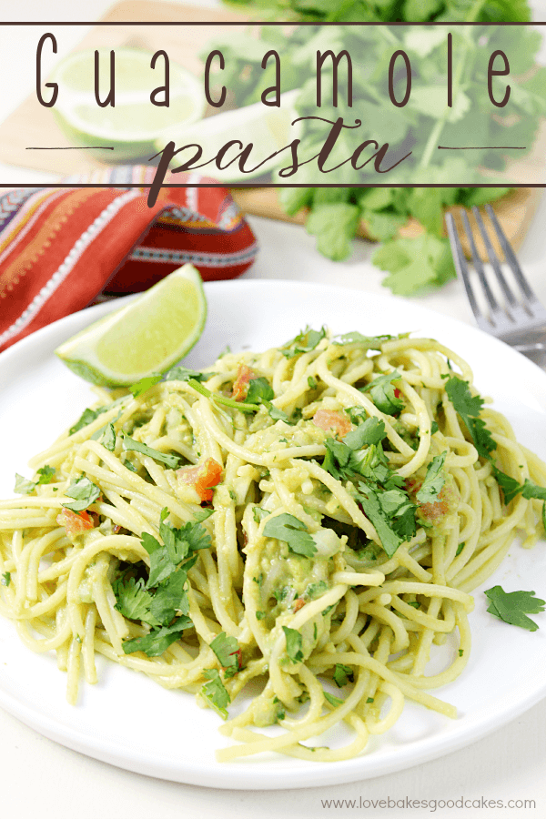 Guacamole Pasta on a white plate with a fork.