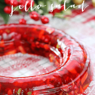 Red Hot Jello Salad on a clear cake plate.