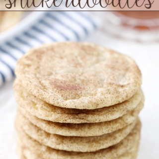 Caramel-Studded Snickerdoodles stacked up on a white plate.
