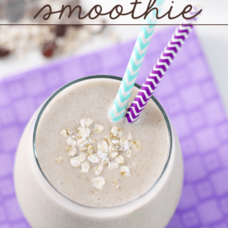 Banana Bread Smoothie in a glass with two straws.
