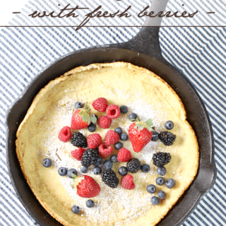 Dutch Baby Pancake with Fresh Berries in a skillet.