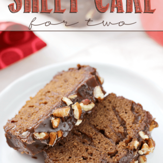 Texas Sheet Cake for Two pieces stacked on a white plate.