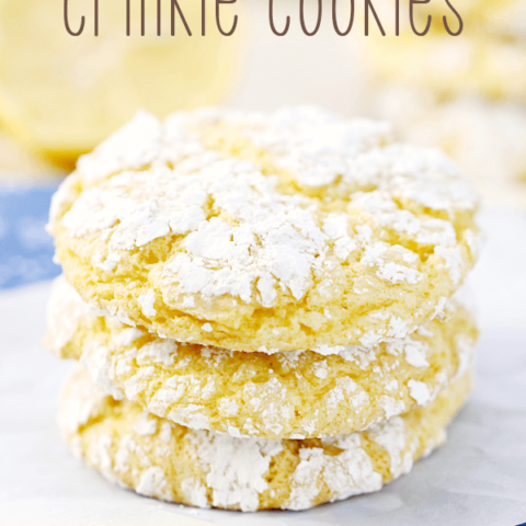 Lemon Crinkle Cookies stacked up on wax paper.