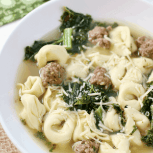 Italian Tortellini Soup in a white bowl.