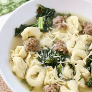 Italian Tortellini Soup in a white bowl.