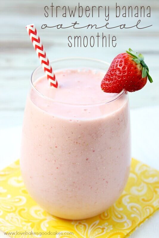 Strawberry Banana Oatmeal Smoothie in a glass with a strawberry, and a straw.