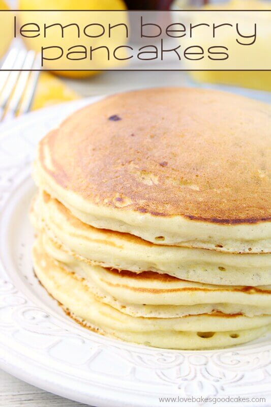 Lemon Berry Pancakes stacked on a white plate.