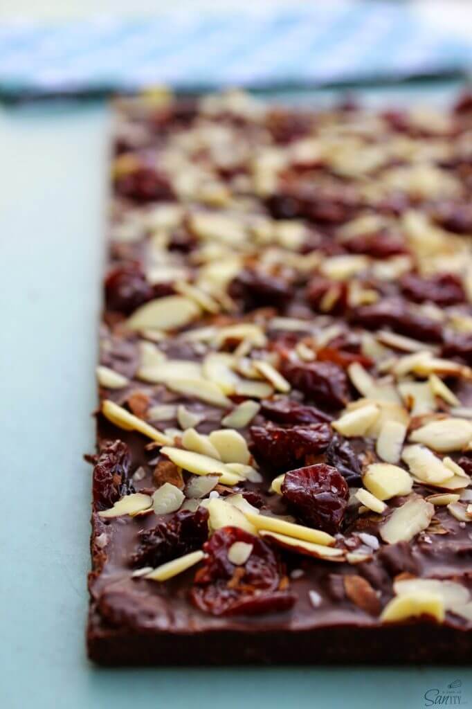 Crispy Dark Chocolate Cherry & Almond Bar close up to show detailed ingredients.