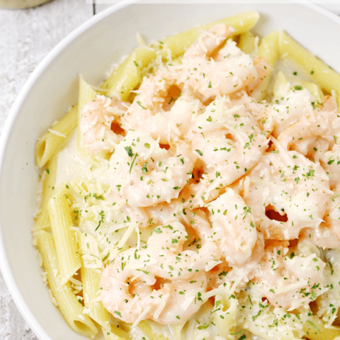 Parmesan Italian Shrimp with Pasta in a white bowl.
