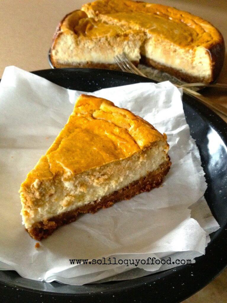 Pumpkin Layer Cheesecake on a plate with a fork.