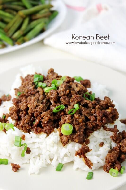 Korean Beef on a white plate with diced green onions.