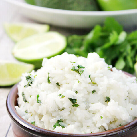 Cilantro Lime Rice in a brown bowl, close up to show texture.