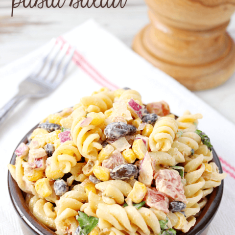 Creamy Chipotle Pasta Salad in a brown bowl with a fork.