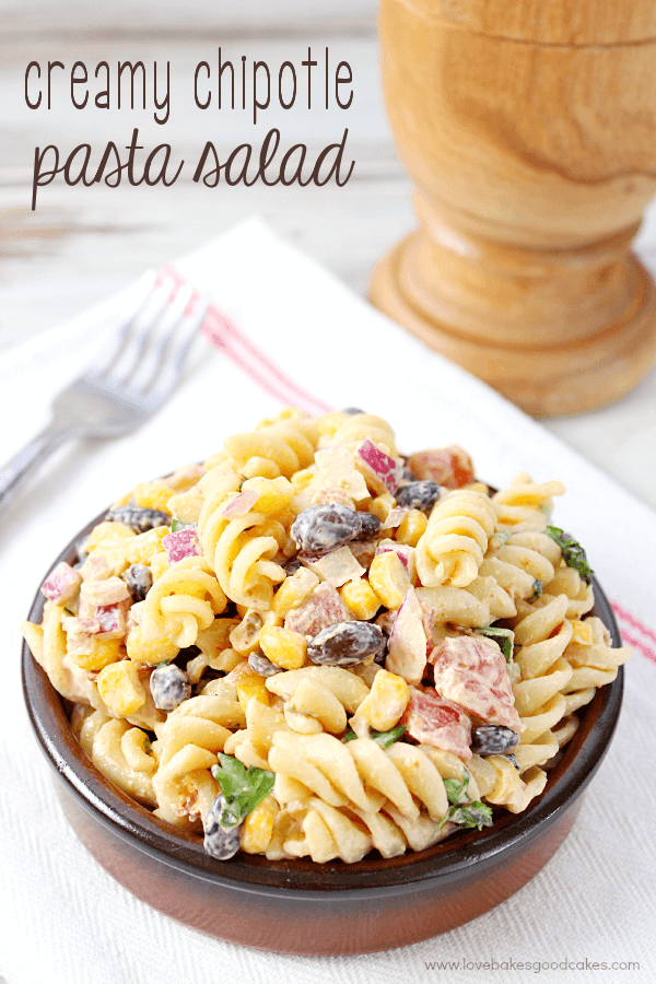 Creamy Chipotle Pasta Salad in a brown bowl with a fork.