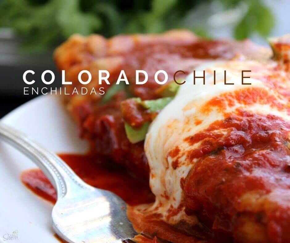 Colorado Chile Enchiladas on a white plate with a fork.
