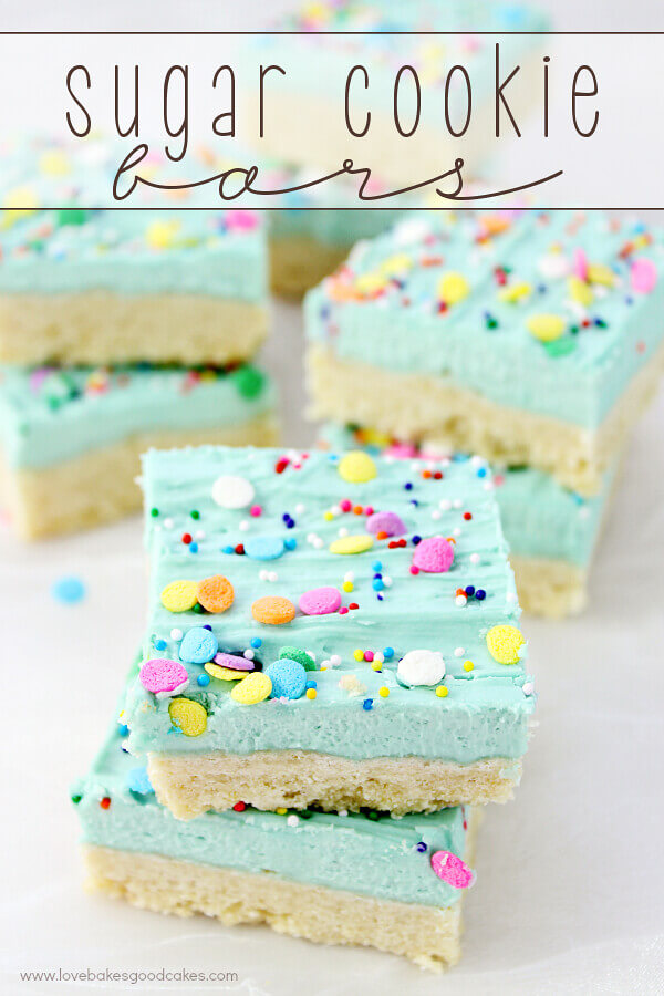 Sugar Cookie Bars stacked on parchment paper.