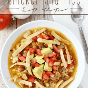 Mexican Chicken and Rice Soup in a white bowl with a spoon.