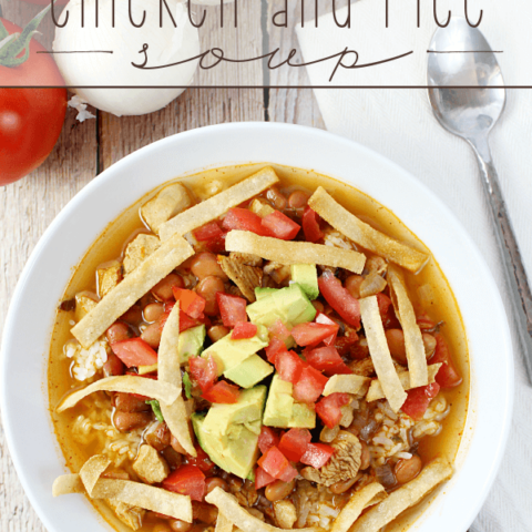 Mexican Chicken and Rice Soup in a white bowl with a spoon.