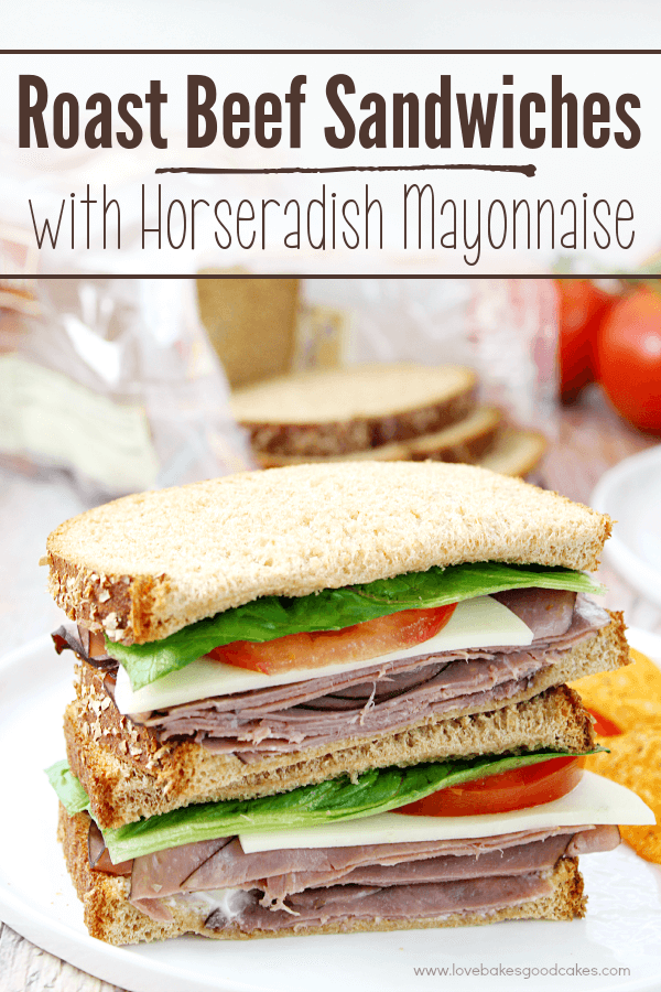 Roast Beef Sandwiches with Horseradish Mayonnaise stacked up on a white plate.