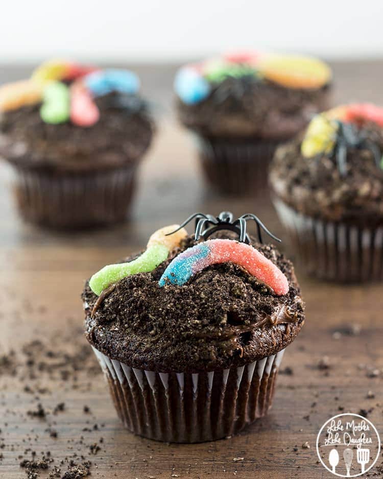 Dirt cupcakes laying on a cutting board.