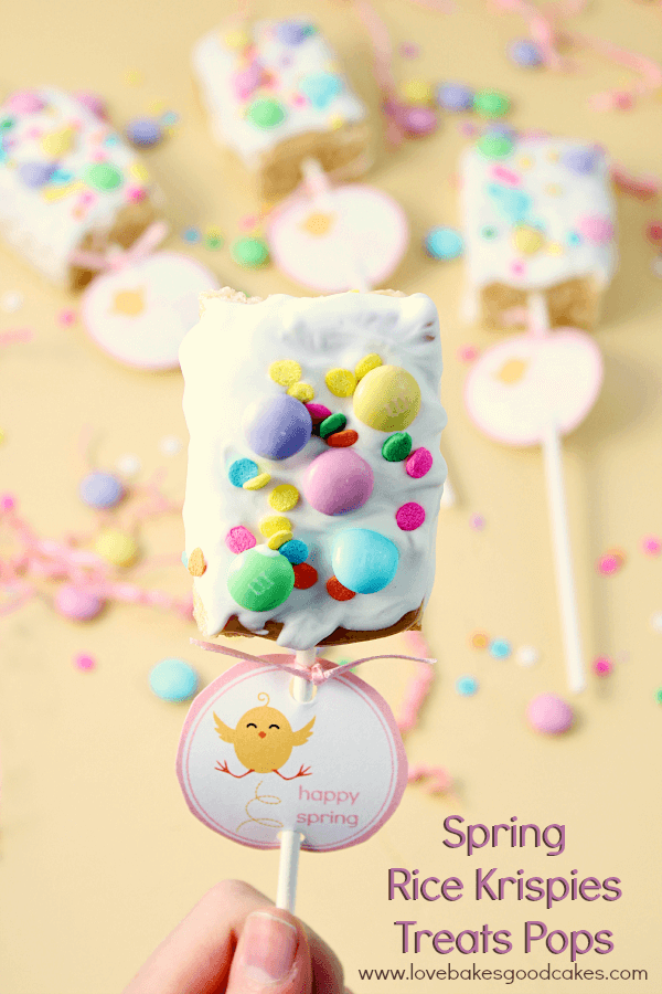 Spring Rice Krispies Treats Pops in someone's hand.
