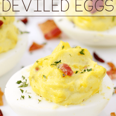 Bacon Cheddar Deviled Eggs on a white plate.