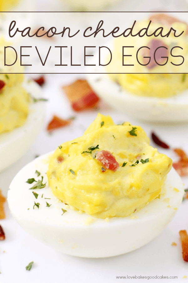 Bacon Cheddar Deviled Eggs on a white plate.
