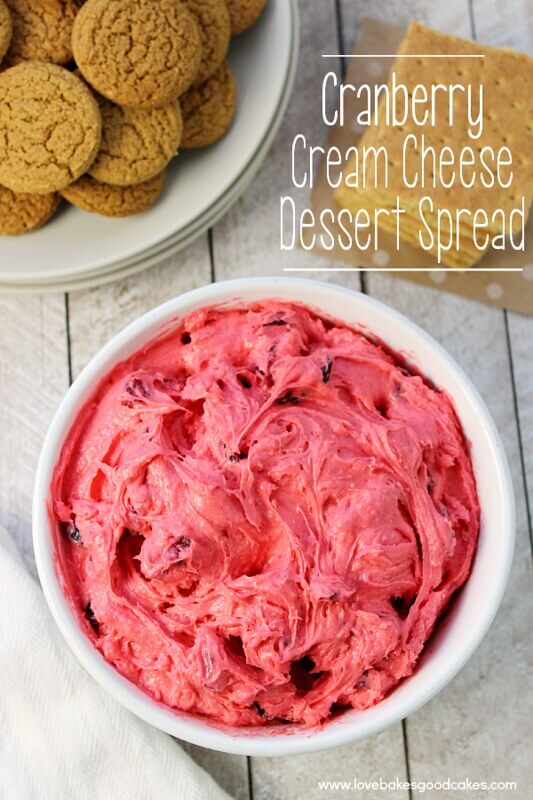 Cranberry Cream Cheese Dessert Spread in a white bowl, with another bowl of cookies.