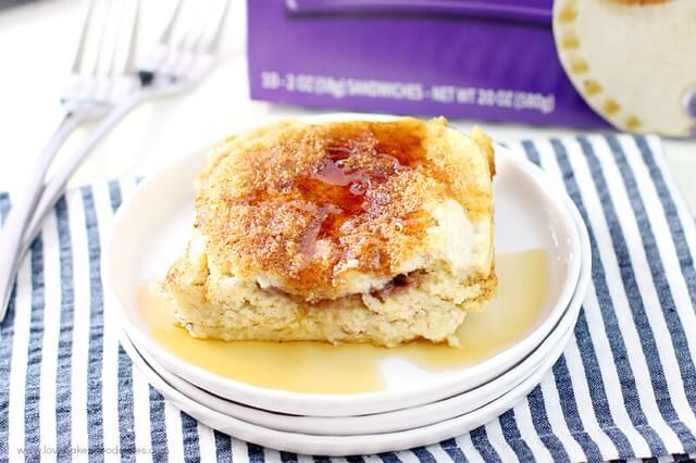 Uncrustables® Overnight French Toast on a white plate with two forks.