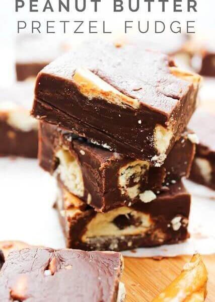 Peanut Butter Pretzel Fudge stacked up on a cutting board.