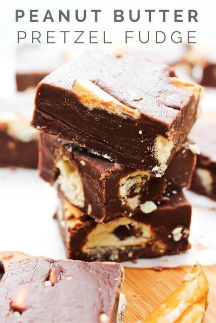 Peanut Butter Pretzel Fudge stacked up on a cutting board.