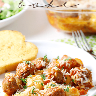 Gnocchi and Meatball Bake on a white plate with French bread and a fork.