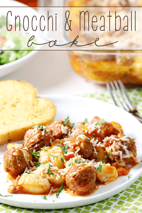 Gnocchi and Meatball Bake on a white plate with French bread and a fork.