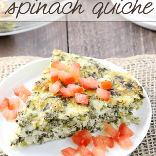 Crustless Spinach Quiche on a white plate with fresh tomatoes.