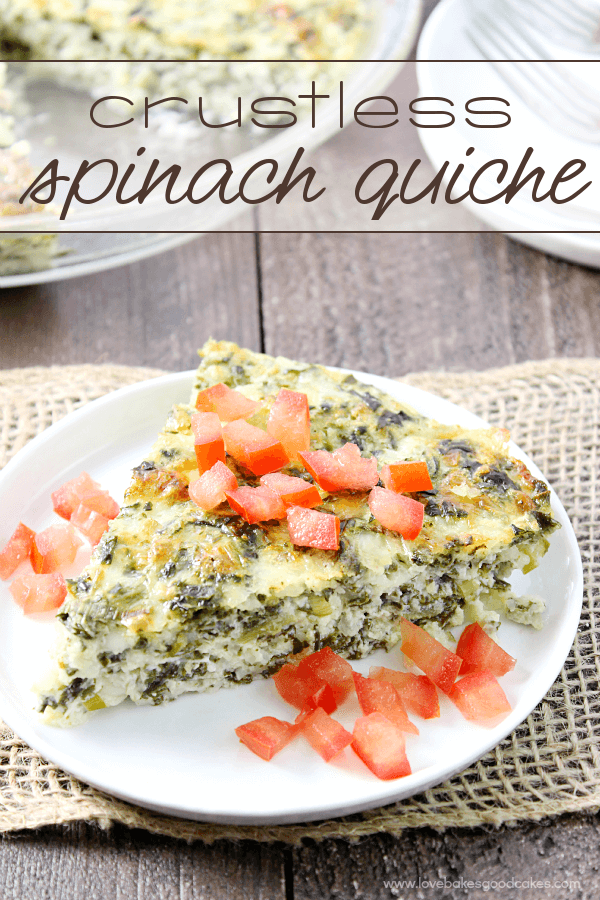 Crustless Spinach Quiche on a white plate with fresh tomatoes.