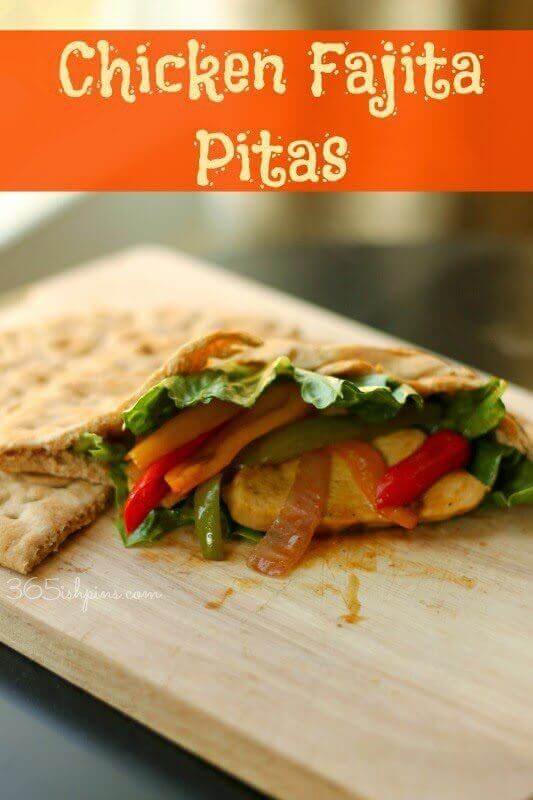 Chicken Fajita Pitas on a wooden cutting board.