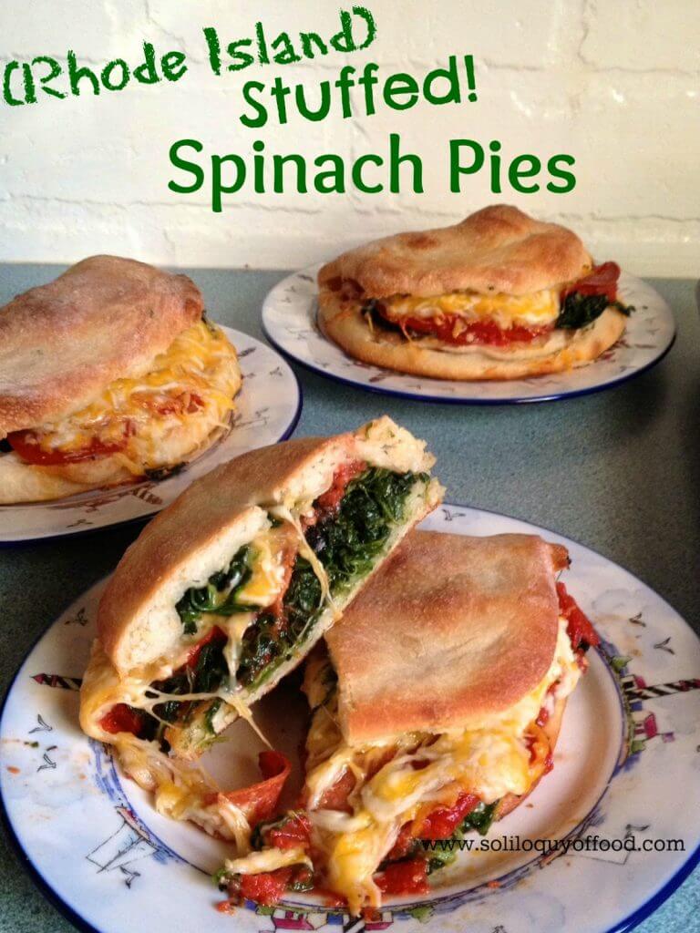 Rhode Island stuffed spinach pies on three plates.