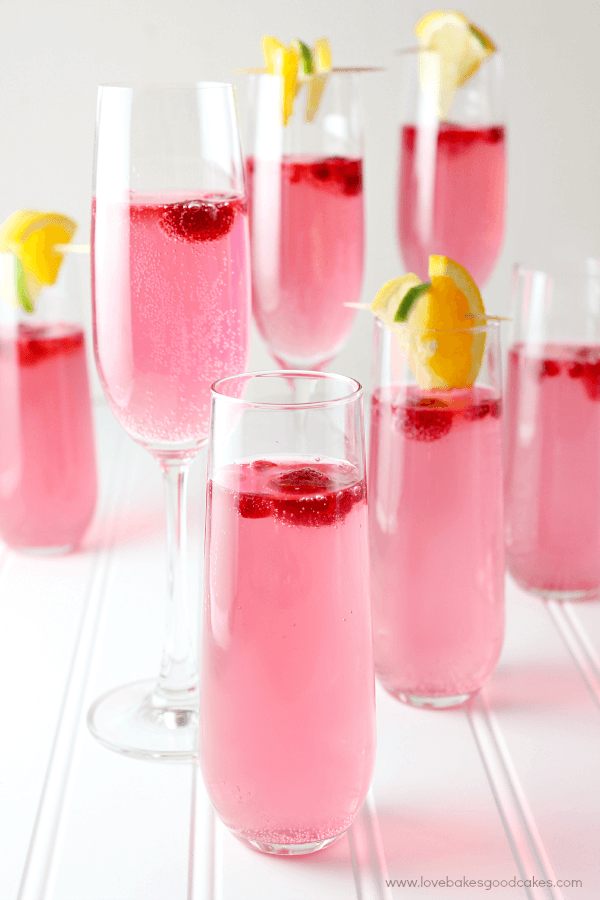 Drink Pink Mocktail in glasses with fresh strawberries and lemon lime.