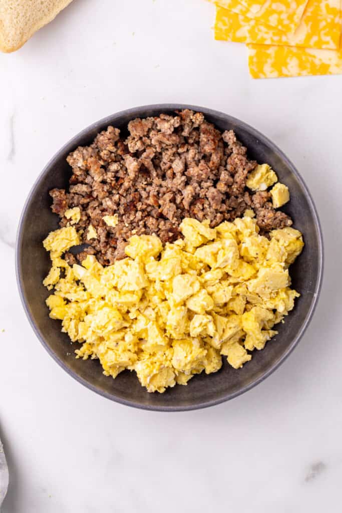 Scrambled eggs and sausage combined in a bowl for Breakfast Grilled Cheese