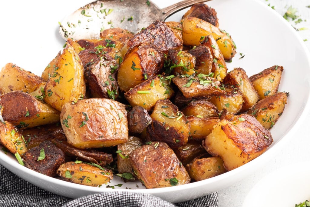 crispy roasted potatoes in serving bowl