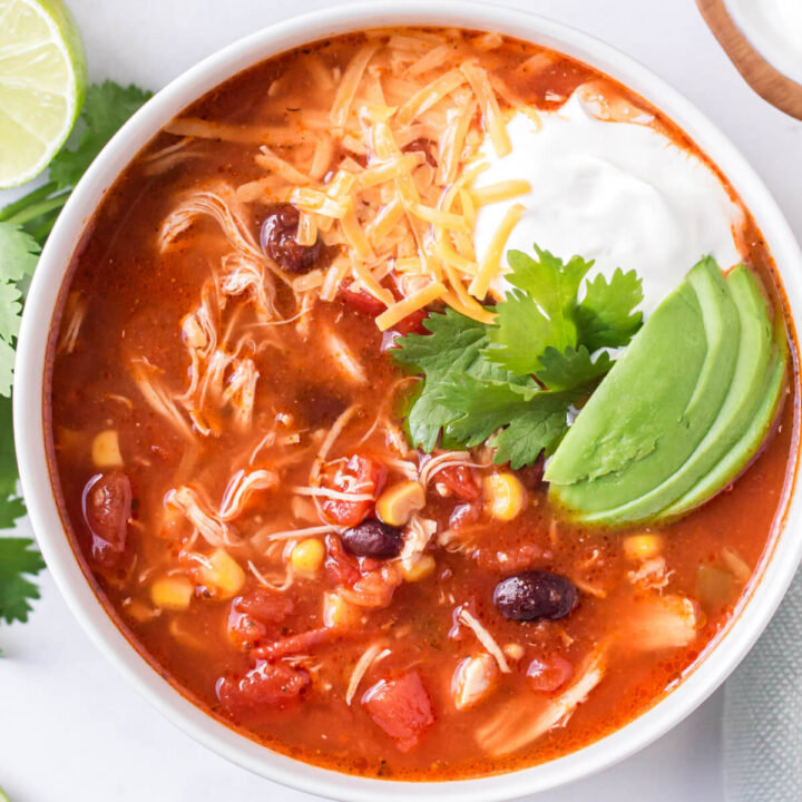 closeup of enchilada soup in white bowl