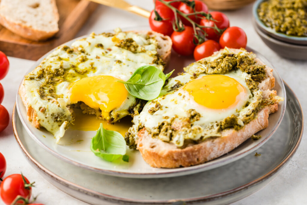 pesto eggs on toast on plate