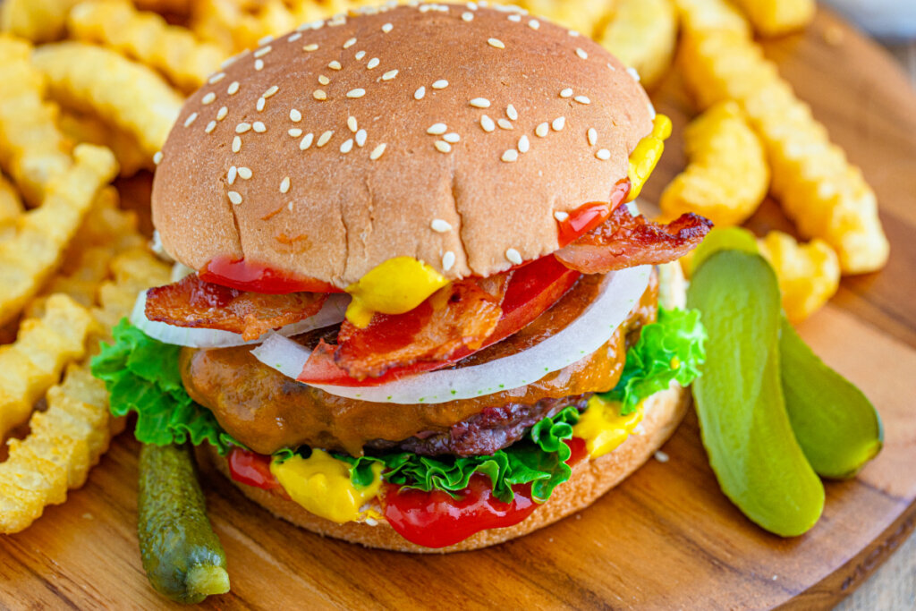 closeup of venison burger on wooden cutting board