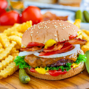 juicy and flavorful venison burger with fries on the side