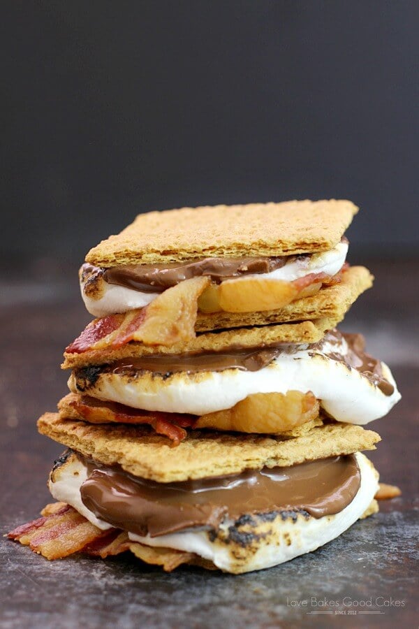 Bacon S'mores stacked up on a cutting board.