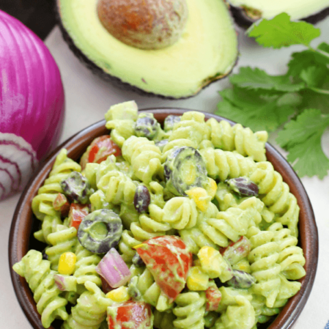 Avocado-Cilantro Pasta Salad in a brown bowl.