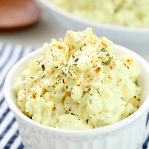 Old-Fashioned Potato Salad in a white bowl, shown close up for texture.