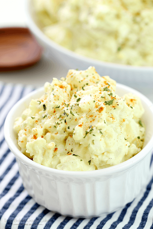 Old-Fashioned Potato Salad in a white bowl, shown close up for texture.
