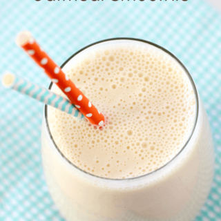 Peach-Banana Oatmeal Smoothie in a glass with two straws.