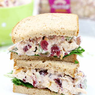 Lighter Chicken Salad Sandwiches stacked on a white plate.